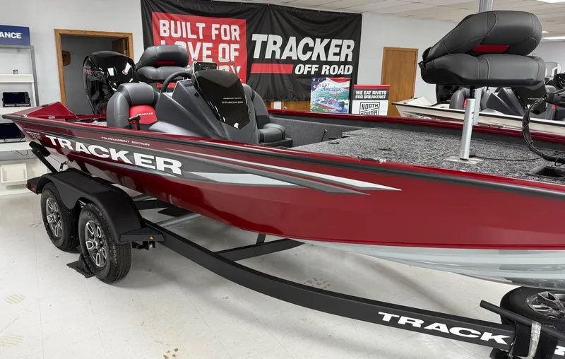 The Image of 2025 Tracker Pro Team 195 Tournament Edition boat in showroom, red with black accents. - 0