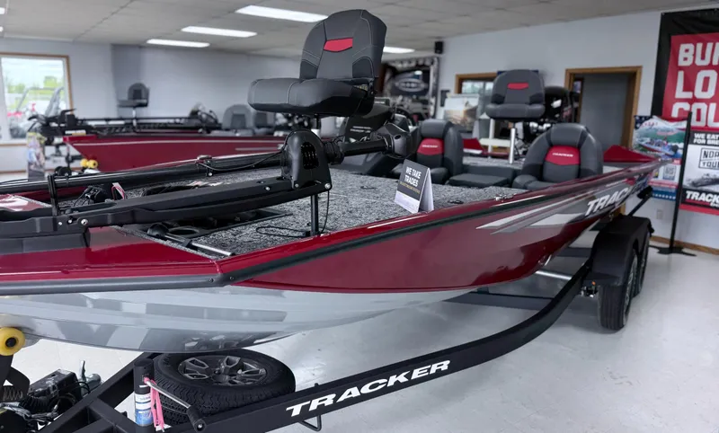 Slide: The Image of 2025 Tracker Pro Team 195 Tournament Edition boat displayed in showroom. - 11