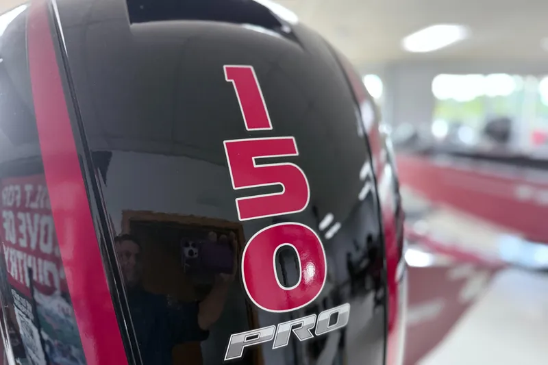 Slide: The Image of Close-up of 2025 Tracker Pro Team 195 Tournament Edition boat engine with "150 Pro" label. - 13