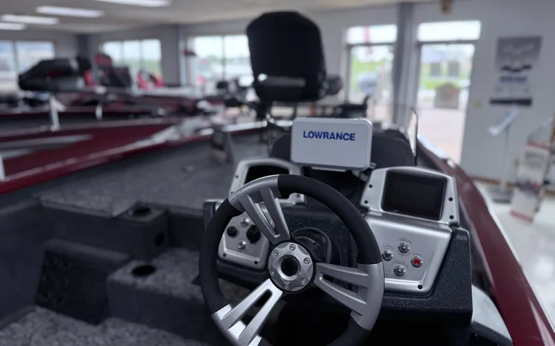 Slide: The Image of 2025 Tracker Pro Team 195 Tournament Edition boat interior with steering wheel and Lowrance electronics. - 14