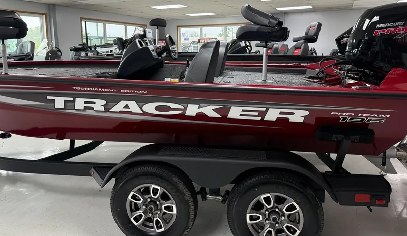 Slide: The Image of 2025 Tracker Pro Team 195 Tournament Edition boat in showroom, side view. - 4