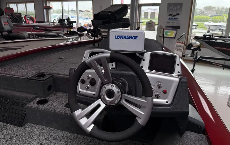 Slide: The Image of 2025 Tracker Pro Team 195 Tournament Edition boat dashboard with steering wheel and Lowrance display. - 5
