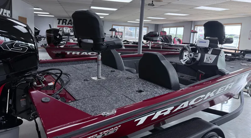 Slide: The Image of 2025 Tracker Pro Team 195 Tournament Edition boat in showroom, featuring sleek design and modern equipment. - 9