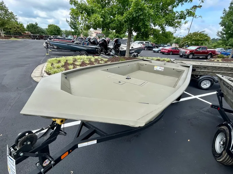 Slide: The Image of 2025 Tracker GRIZZLY 1860 Utility boat on trailer in parking lot. - 3