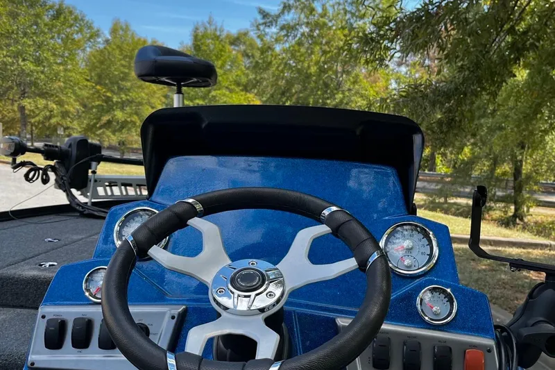 Slide: The Image of Steering console of a 2025 Nitro Z18 boat with gauges and controls. - 6