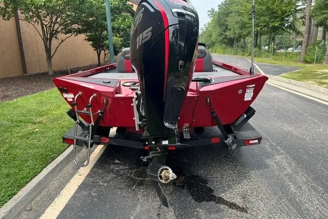 Slide: The Image of 2025 Ranger RT188P boat with powerful outboard motor, parked on a street. - 3