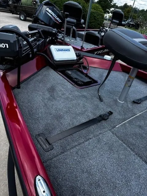 Slide: The Image of 2025 Ranger RT188P boat deck with Lowrance electronics and Mercury motor, featuring a red and gray design. - 4