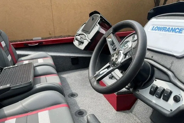 Slide: The Image of 2025 Ranger RT188P boat interior with steering wheel and Lowrance electronics. - 7
