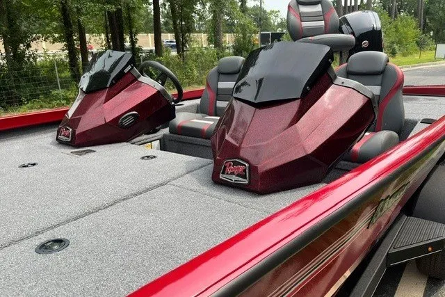 Slide: The Image of 2025 Ranger RT188P boat interior with dual consoles and seating, featuring a sleek red design. - 12
