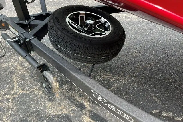 Slide: The Image of 2025 Ranger RT188P trailer with spare tire on asphalt surface. - 11