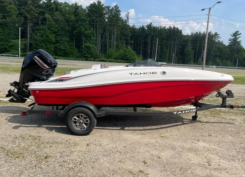 Slide: The Image of 2025 Tahoe T16 boat on trailer, red and white design, parked outdoors. - 1