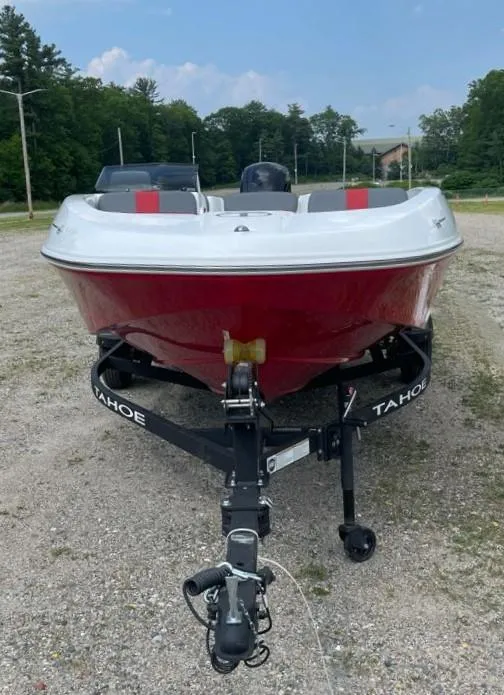 Slide: The Image of 2025 Tahoe T16 boat on trailer, red and white design, parked outdoors. - 3