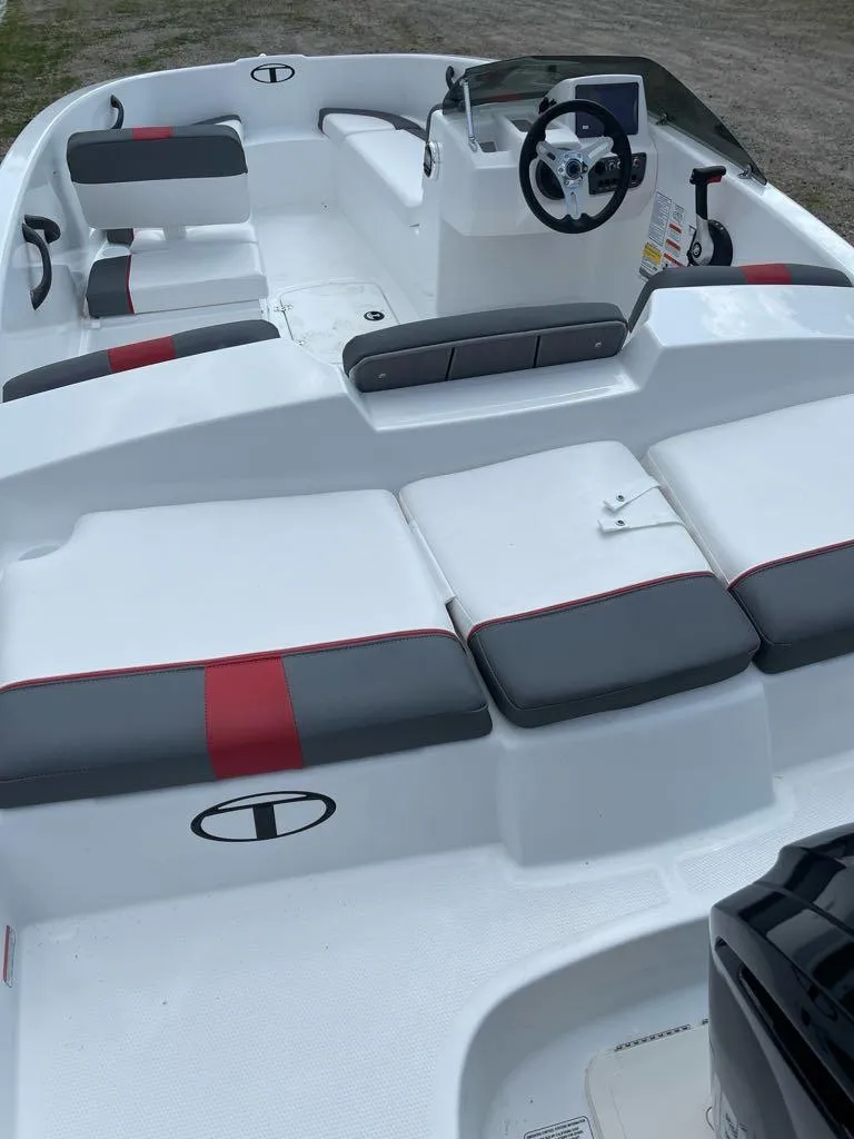 Slide: The Image of 2025 Tahoe T16 boat cockpit with steering wheel and control panel. - 5