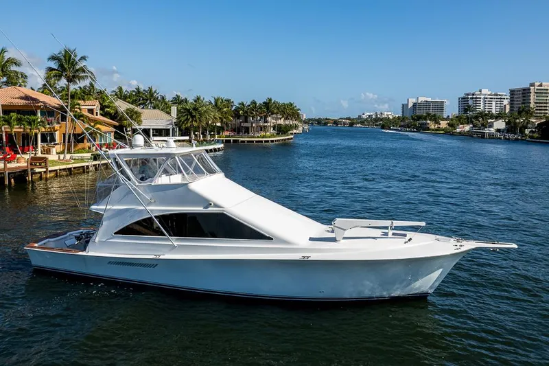 Slide: The Image of 1999 Ocean Yachts 60 Convertible cruising on a scenic waterway. - 10