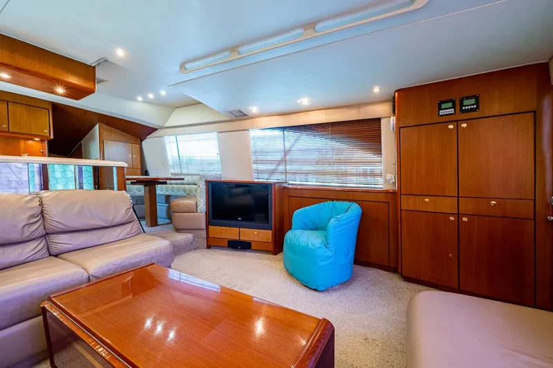 Slide: The Image of Luxurious interior of 1999 Ocean Yachts 60 Convertible with plush seating and modern amenities. - 18