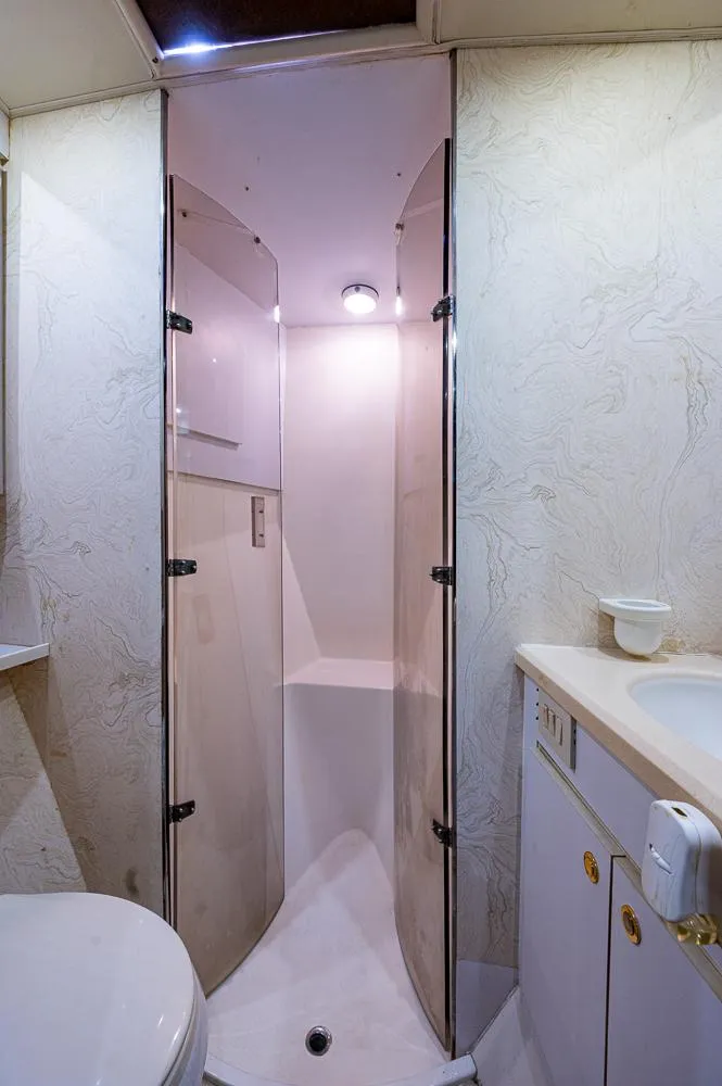 Slide: The Image of Bathroom interior of 1999 Ocean Yachts 60 Convertible with shower and sink. - 29