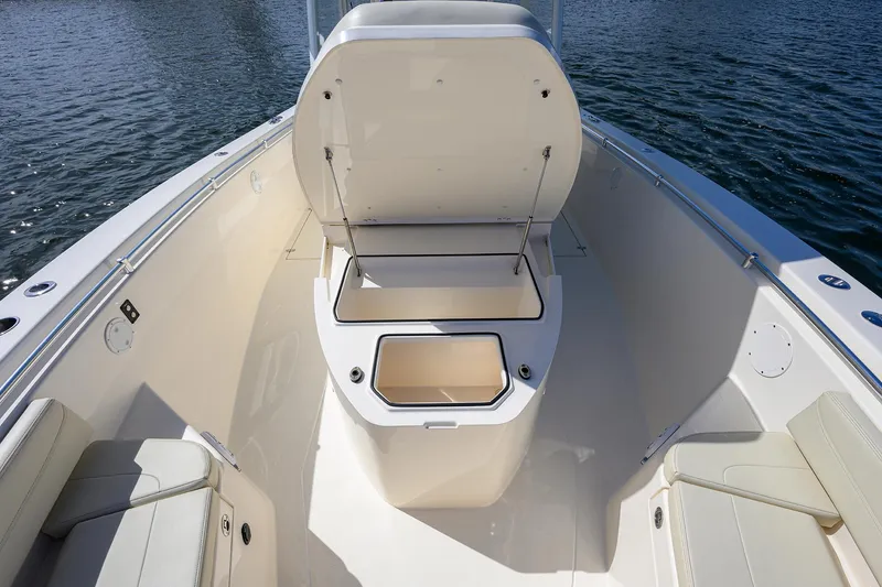 Slide: The Image of 2022 Cobia 350 Center Console boat interior with open storage compartment. - 15