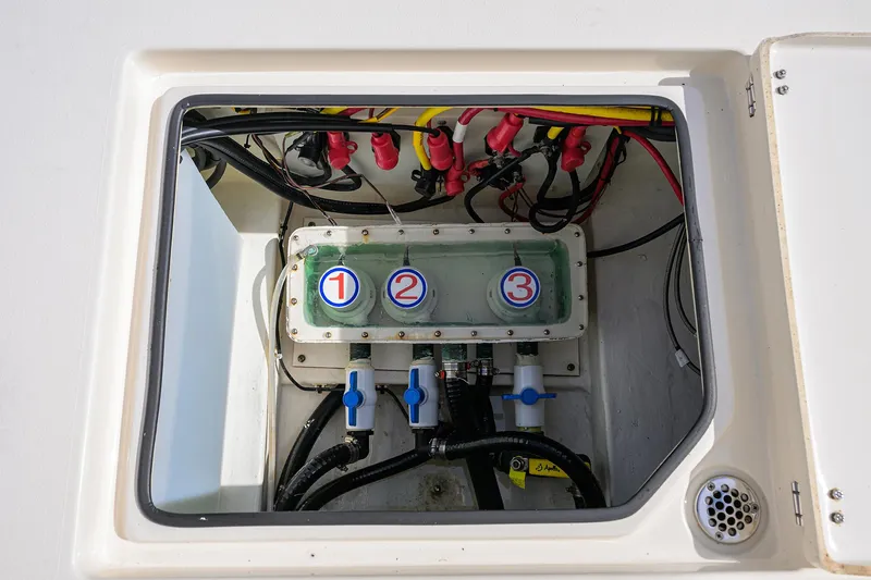 Slide: The Image of 2022 Cobia 350 Center Console electrical panel with numbered switches and wiring. - 22