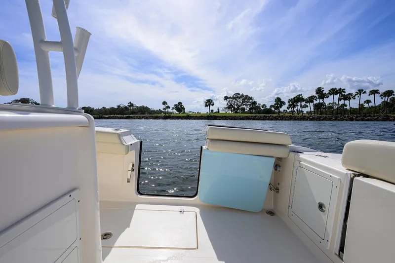 Slide: The Image of 2022 Cobia 350 Center Console boat interior with scenic water view. - 23