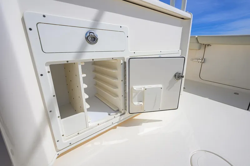 Slide: The Image of 2022 Cobia 350 Center Console storage compartments on deck, showcasing organization and functionality. - 24