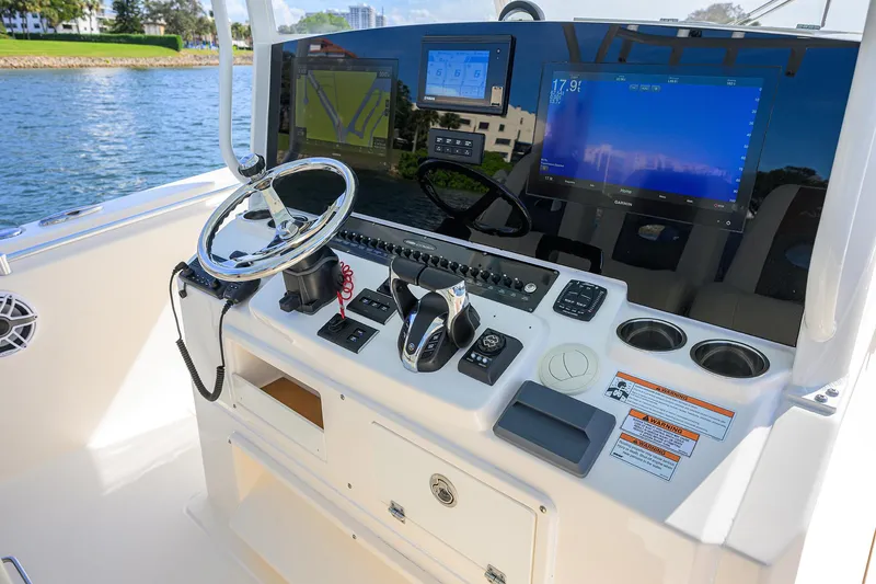 Slide: The Image of 2022 Cobia 350 Center Console helm with advanced navigation and control systems. - 32