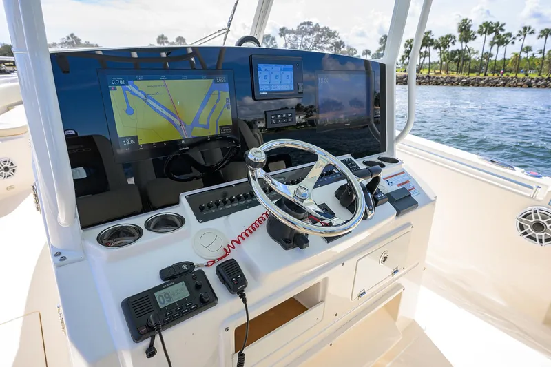 Slide: The Image of 2022 Cobia 350 Center Console helm with advanced navigation displays and controls. - 4