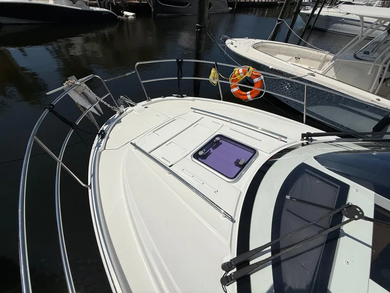 Slide: The Image of 2018 Jeanneau NC 895 boat deck with railing and life preserver. - 28