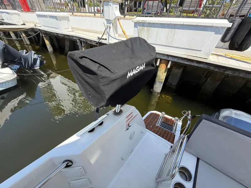 Slide: The Image of 2018 Jeanneau NC 895 boat with Magma grill cover at dockside. - 31