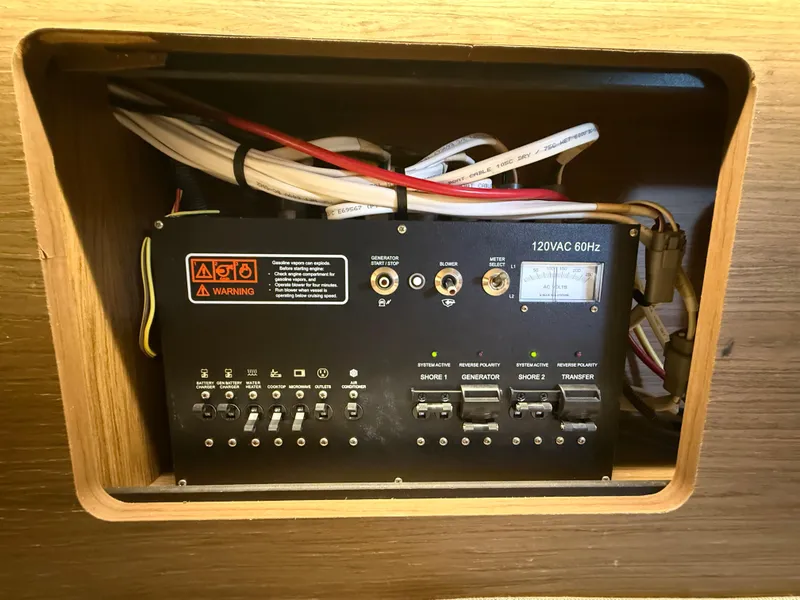 Slide: The Image of Electrical panel of 2018 Jeanneau NC 895 boat, featuring switches and wiring. - 32