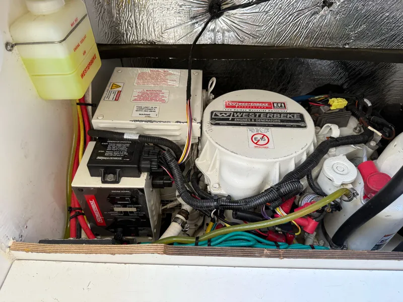 Slide: The Image of Engine compartment of a 2018 Jeanneau NC 895 with Westerbeke generator and wiring. - 35