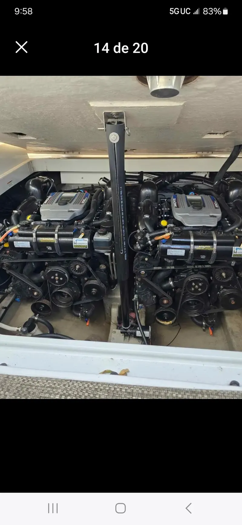 Slide: The Image of Engine compartment of a 2017 Crownline 294 CR boat, showcasing dual engines. - 11