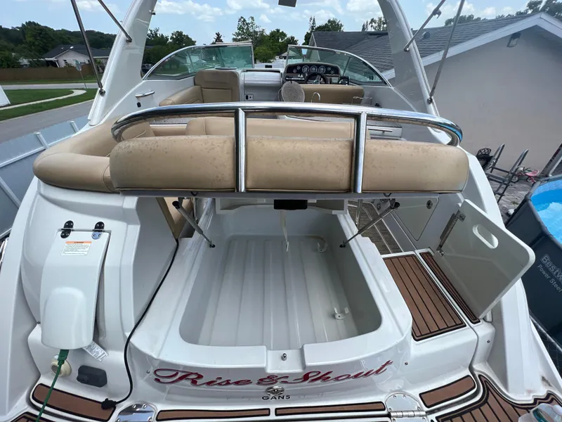 Slide: The Image of 2017 Crownline 294 CR boat with spacious deck and seating area, featuring elegant design elements. - 14