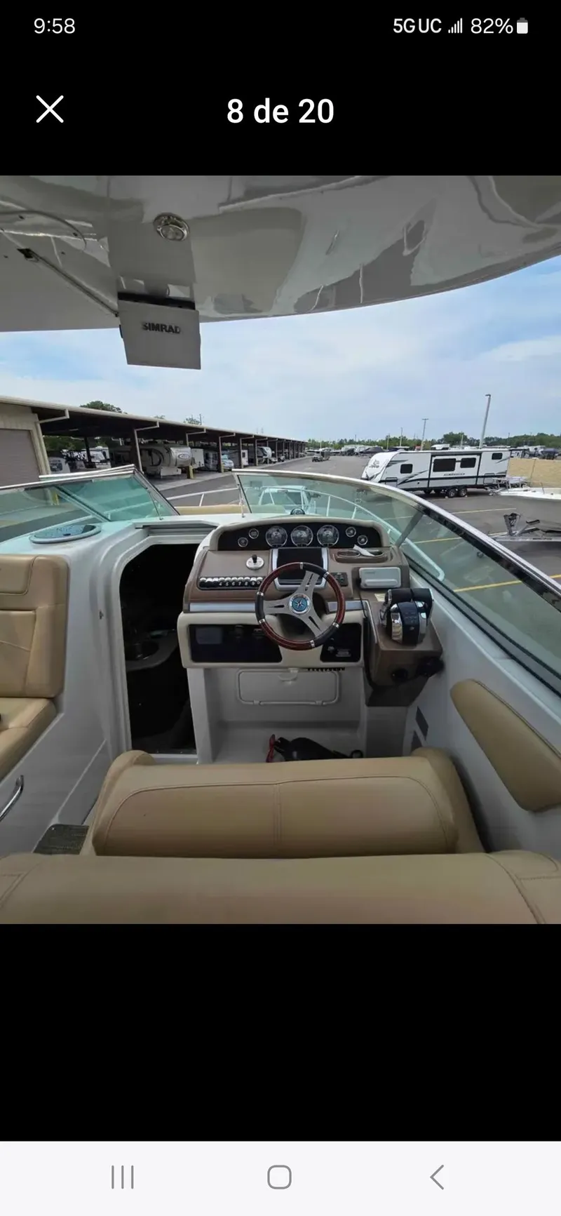 Slide: The Image of 2017 Crownline 294 CR boat interior with beige seating and modern dashboard. - 22