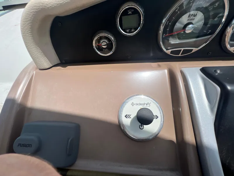 Slide: The Image of Dashboard of 2017 Crownline 294 CR boat with RPM gauge and controls. - 24