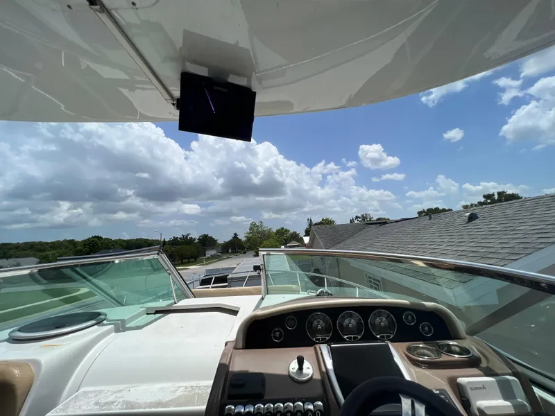 Slide: The Image of 2017 Crownline 294 CR boat dashboard with clear sky and clouds in the background. - 25