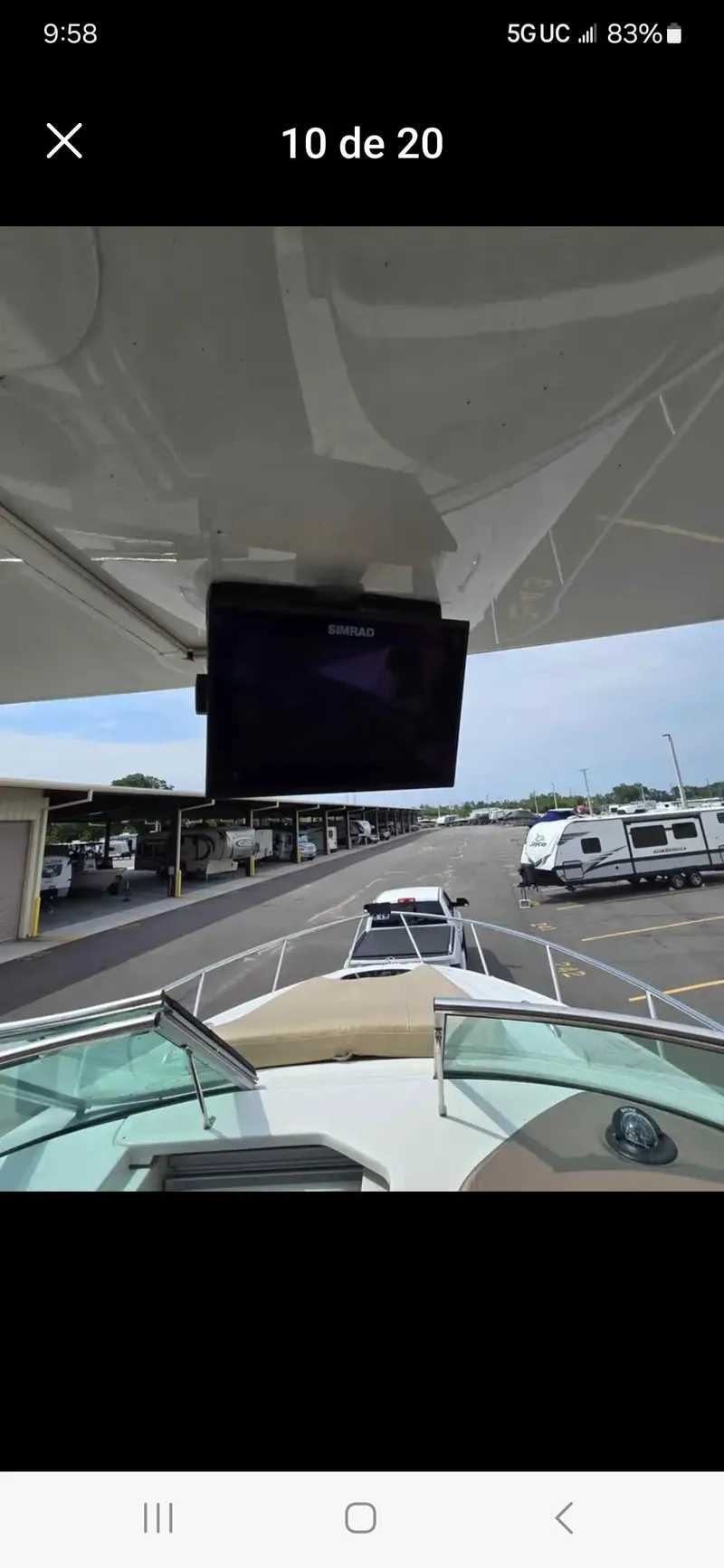 Slide: The Image of 2017 Crownline 294 CR boat docked, view from the deck with marina in background. - 26