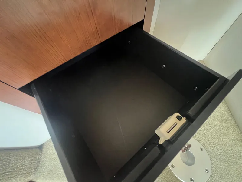 Slide: The Image of Open drawer in 2017 Crownline 294 CR boat interior, showcasing storage space. - 36