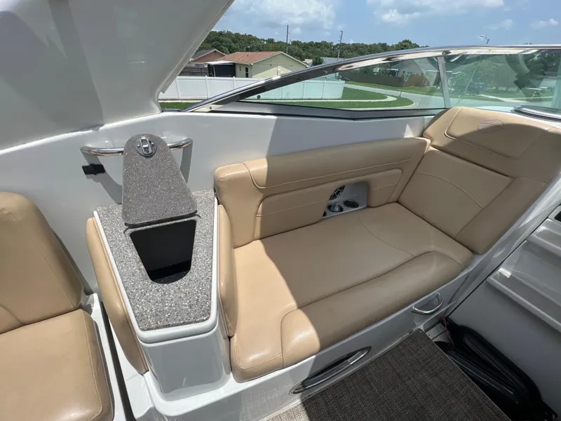 Slide: The Image of 2017 Crownline 294 CR boat interior with tan leather seating and modern design. - 65