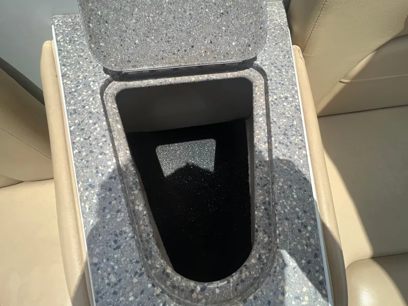 Slide: The Image of 2017 Crownline 294 CR boat interior with open storage compartment. - 66