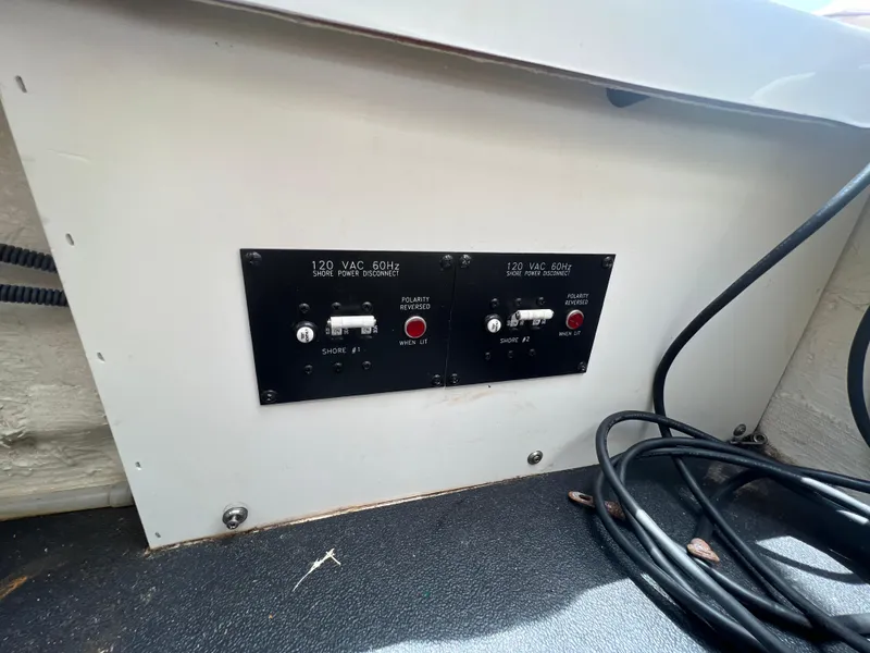 Slide: The Image of Electrical panel on a 2017 Crownline 294 CR boat, featuring switches and wiring. - 70