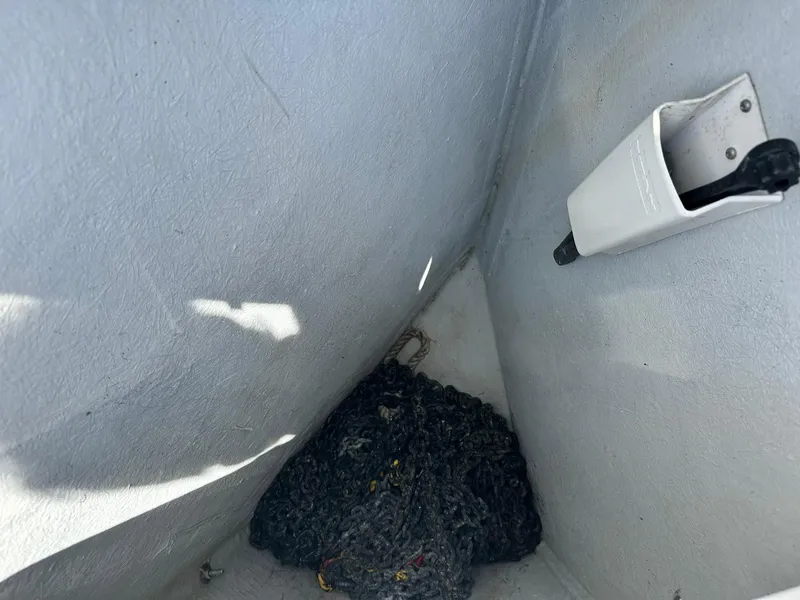 Slide: The Image of Storage compartment on a 2005 Beneteau Swift Trawler 42 with rope and holder. - 13