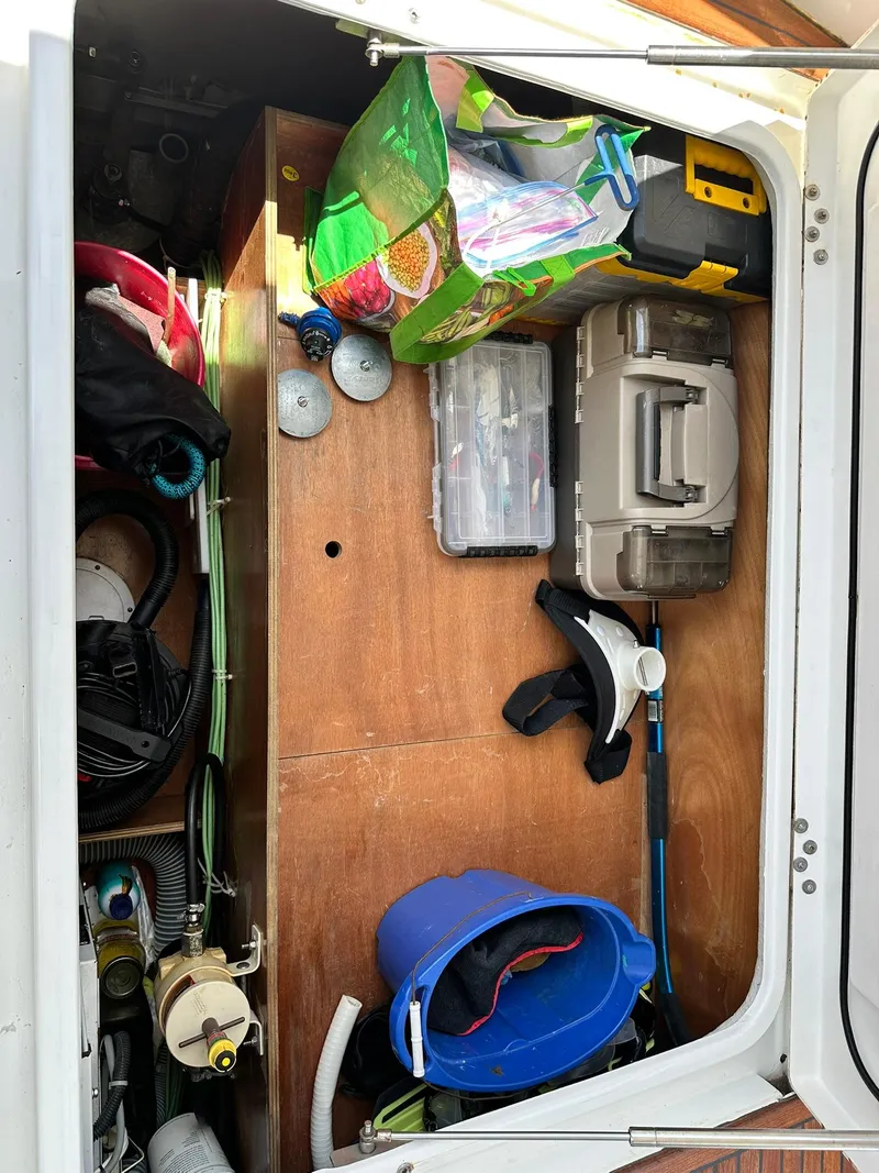 Slide: The Image of Storage compartment on a 2005 Beneteau Swift Trawler 42 with tools and equipment. - 31