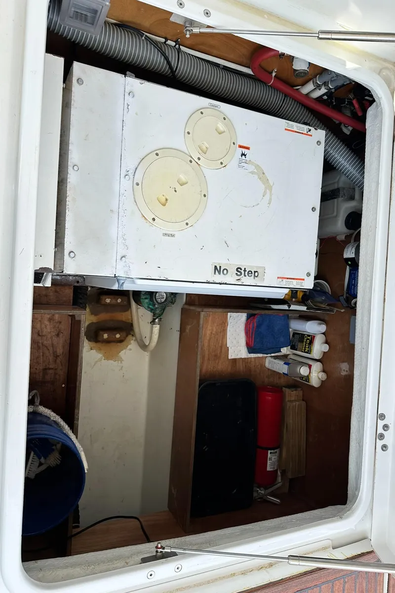 Slide: The Image of Engine compartment of 2005 Beneteau Swift Trawler 42 with storage and equipment. - 32