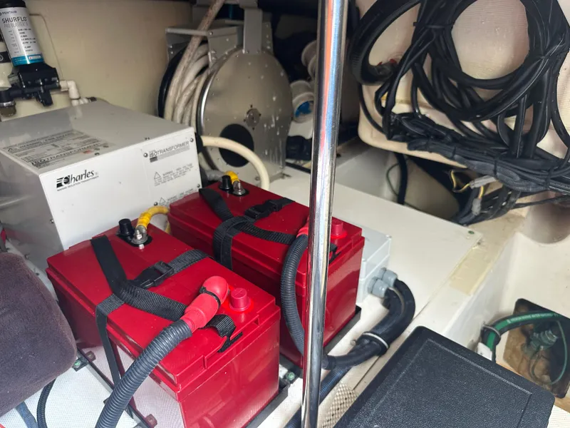 Slide: The Image of Engine compartment of a 2014 Pursuit SC 365i Sport Coupe with red batteries and wiring. - 16