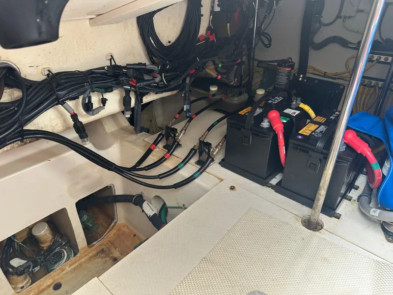 Slide: The Image of Electrical system and batteries in a 2014 Pursuit SC 365i Sport Coupe boat. - 18