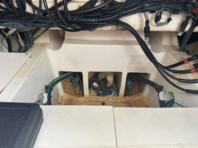 Slide: The Image of Engine compartment of a 2014 Pursuit SC 365i Sport Coupe with visible wiring and hoses. - 20