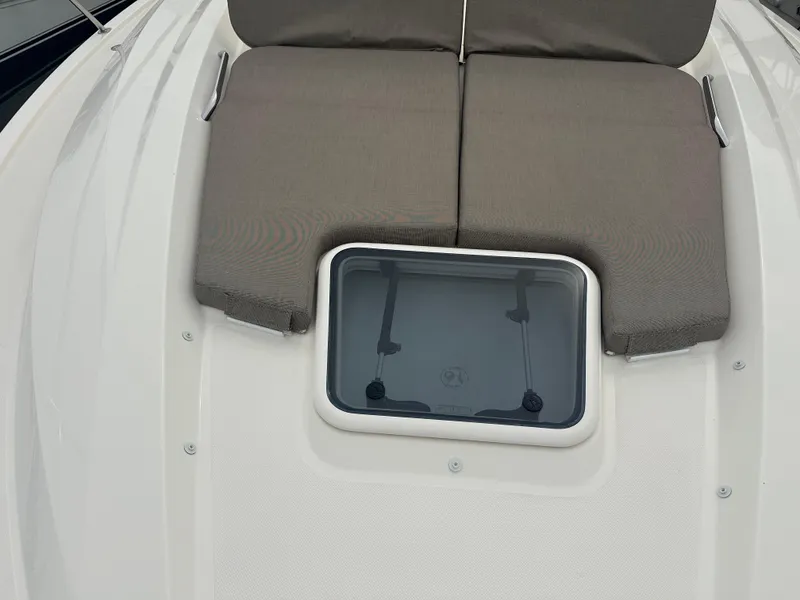 Slide: The Image of 2014 Pursuit SC 365i Sport Coupe with cushioned deck seating and hatch. - 24
