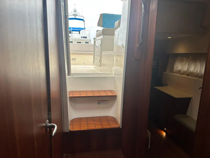 Slide: The Image of Interior view of 2014 Pursuit SC 365i Sport Coupe, showing wooden steps leading to deck. - 36