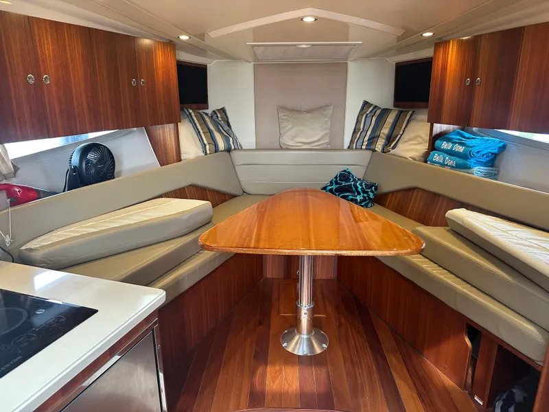 Slide: The Image of Interior of 2014 Pursuit SC 365i Sport Coupe with wood finishes and seating area. - 40
