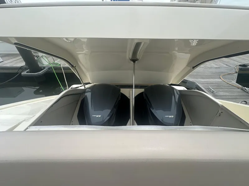 Slide: The Image of 2014 Pursuit SC 365i Sport Coupe with open engine hatch, showcasing dual engines. - 46